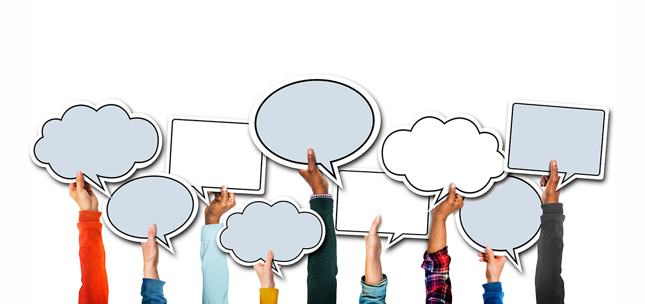 A diverse group of hands raised holding empty speech bubbles.