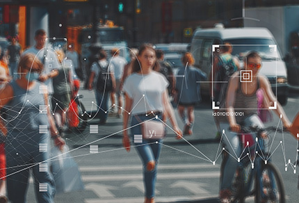 A busy city street scene with graphics depicting surveillance.