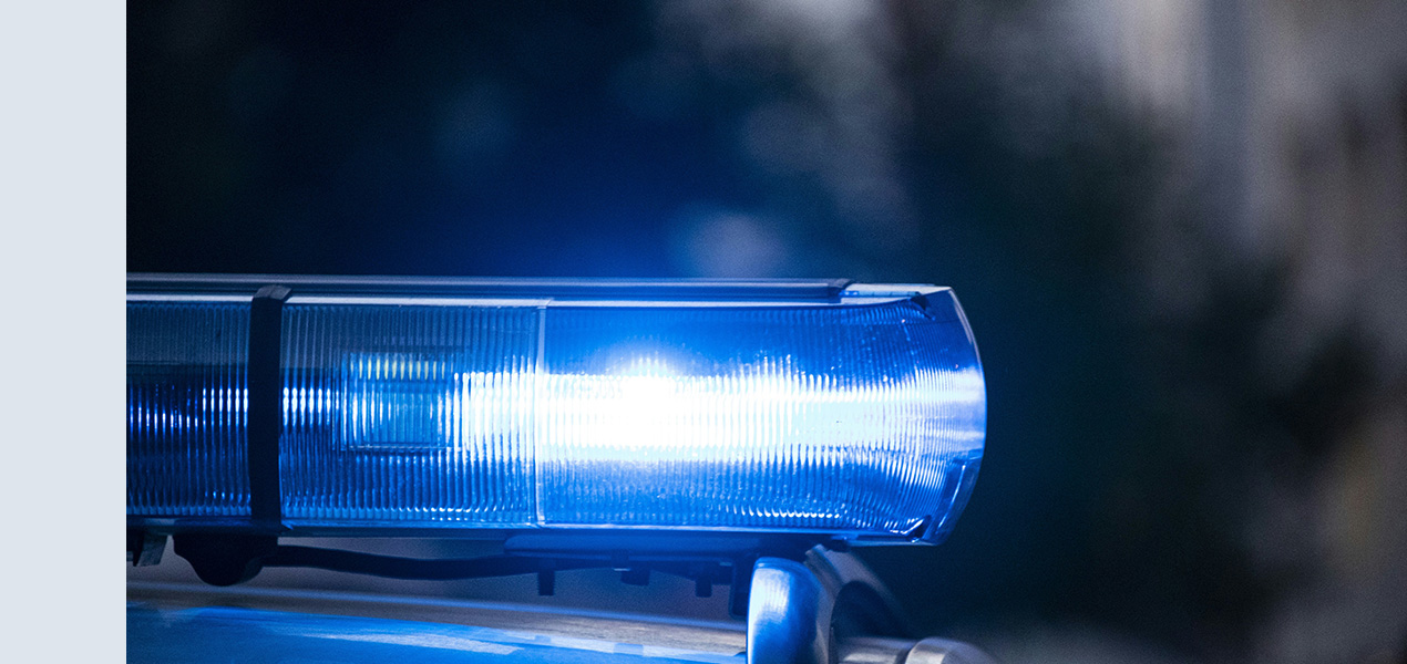 Close up of a light on top of a police car.