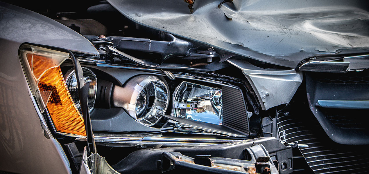 Close up of the front end of a car after an accident