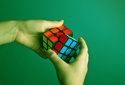 A person solving a Rubix Cube