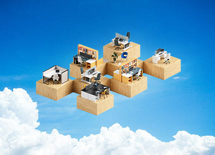 A set of small office desks in front of an open sky.